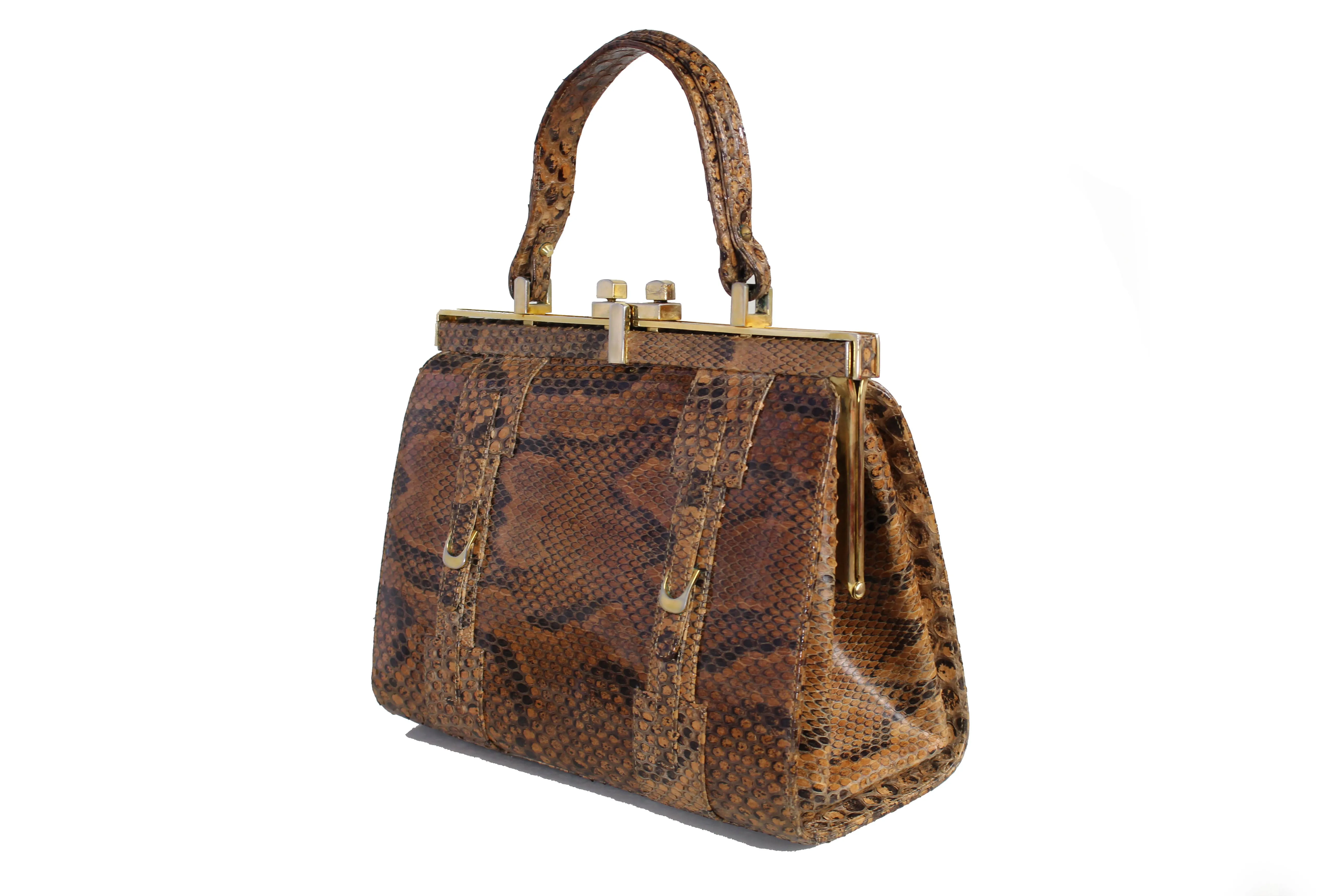 Snake skin handbag with lined frame and single handle