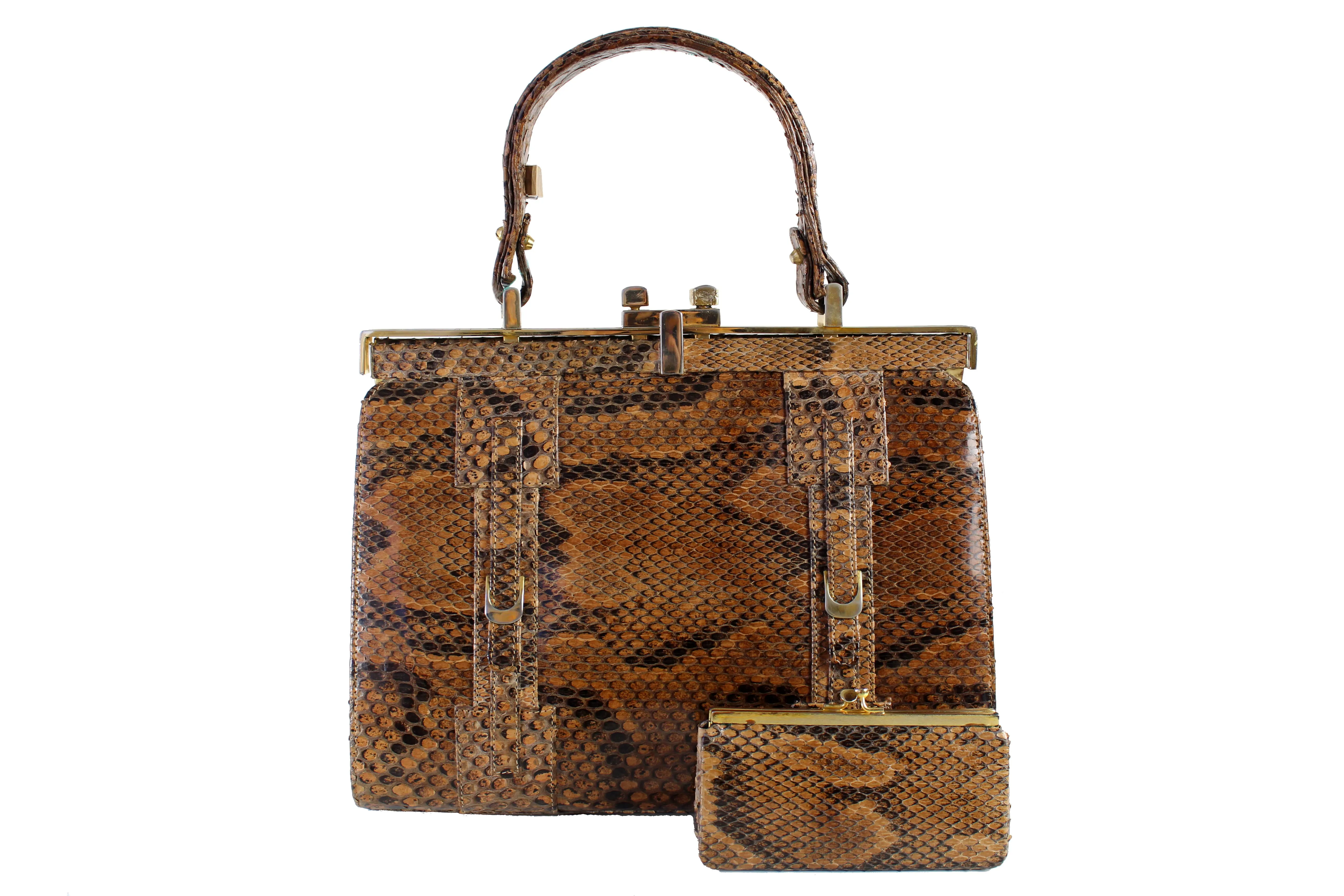 Snake skin handbag with lined frame and single handle