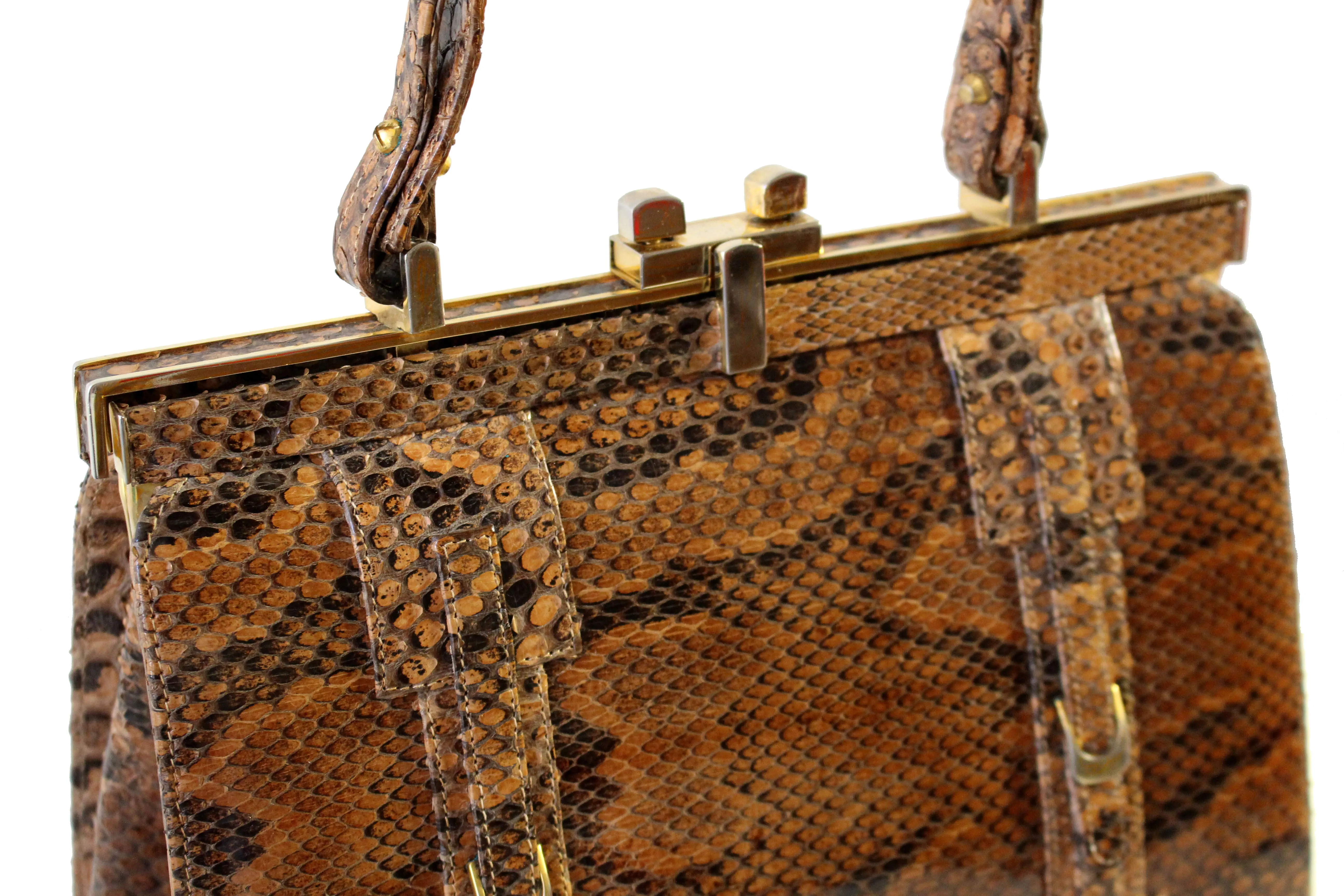 Snake skin handbag with lined frame and single handle