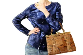 Snake skin handbag with lined frame and single handle